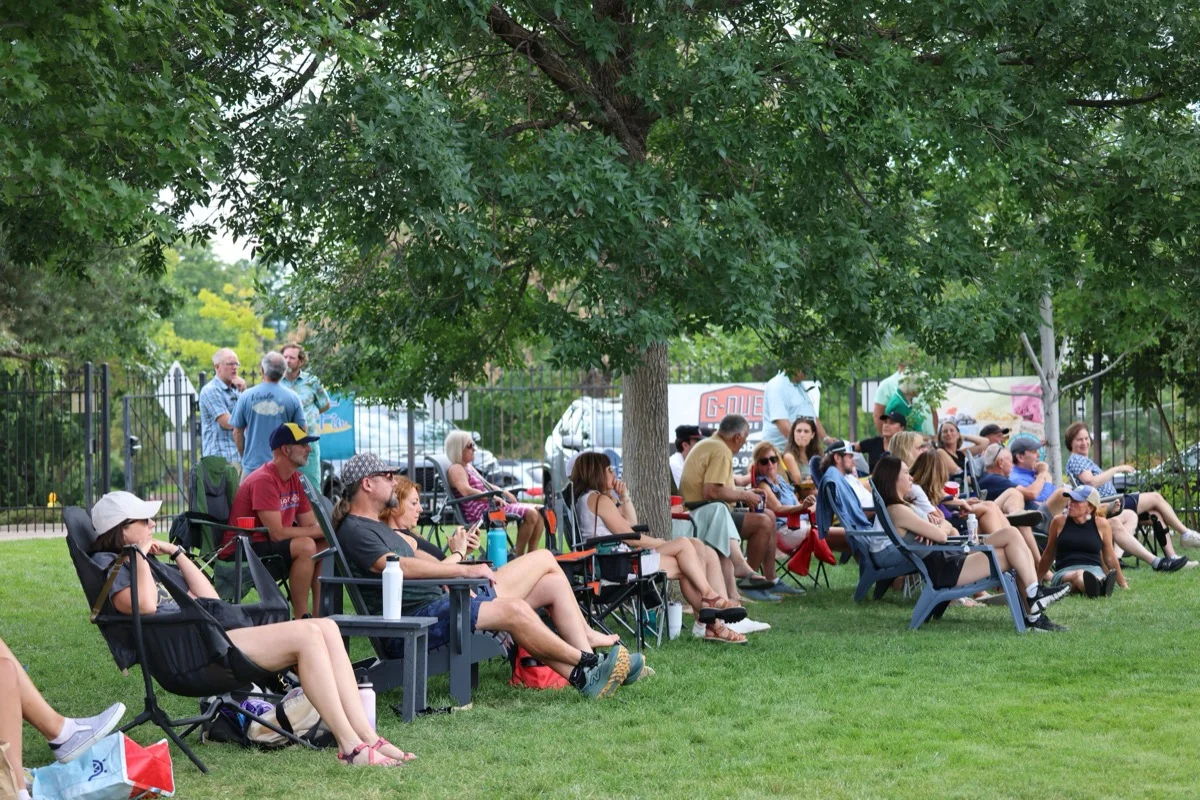 Spectators relaxing on the lawn at Broomfield Open