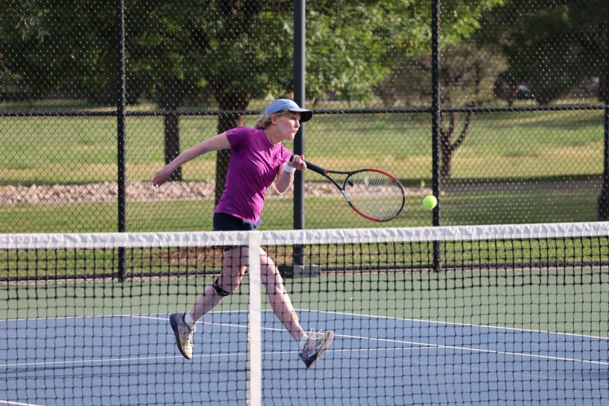 Player hitting a forehand at Broomfield Open