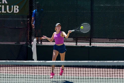 Woman hitting forehand at Denver Tennis Club